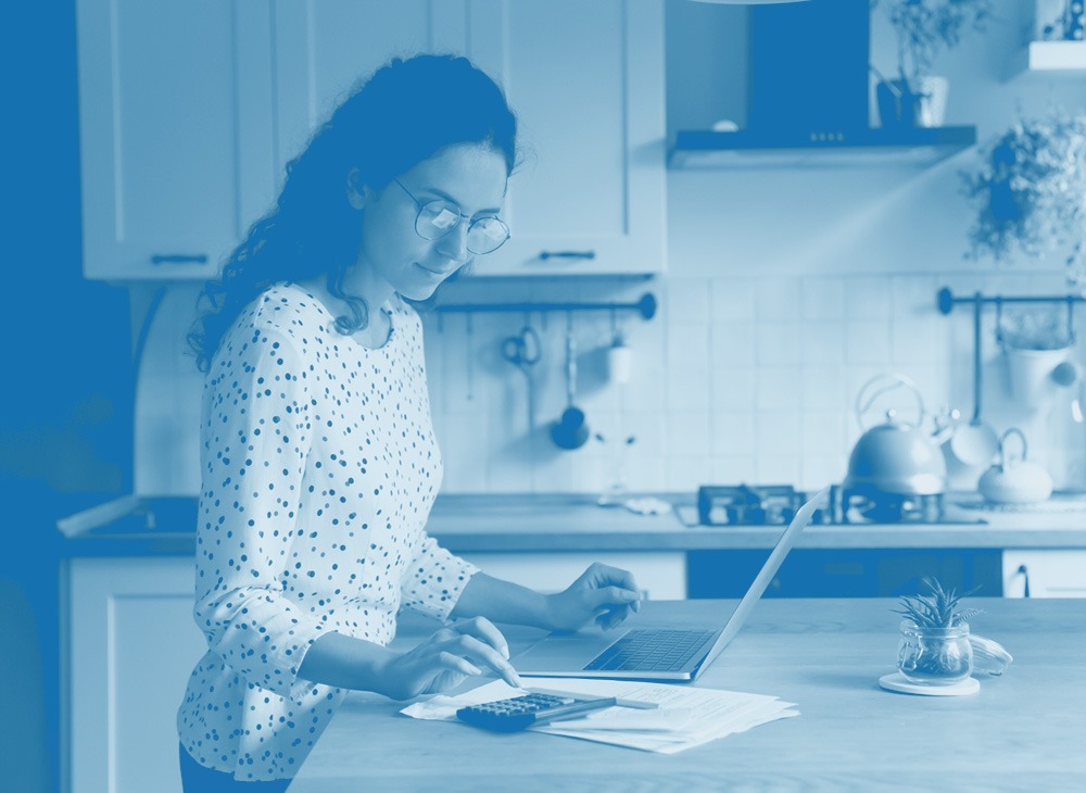 Man smiling looking at phone in home